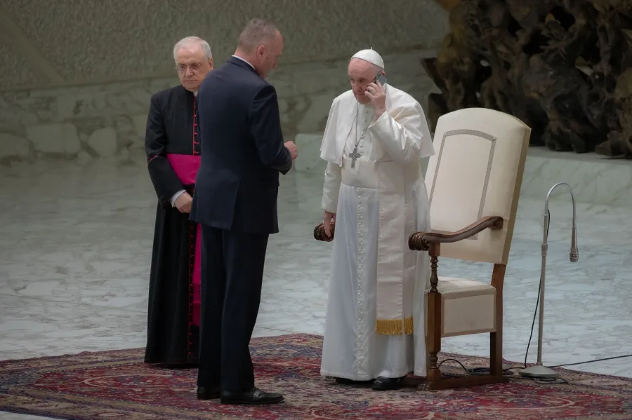 Pope Francis spoke on the phone at the end of his general audience Aug. 11, 2021.?w=200&h=150